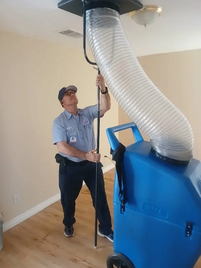 HVAC Installation technician using HEPA equipment in Central